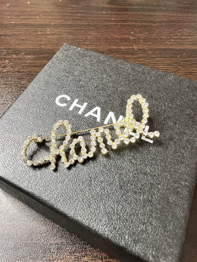 Designer script brooch